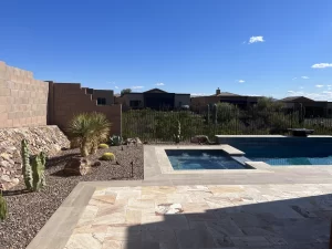 Rattlesnake-proof metal fence around a backyard pool.