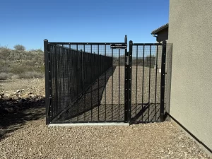 Pet-friendly yard secured by a snake fence and gate.