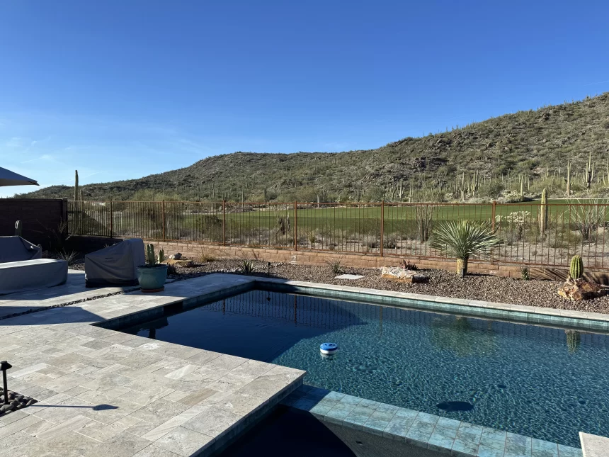 Custom snake fence to keep rattlesnakes out of swimming pool.