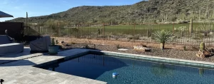 Custom snake fence to keep rattlesnakes out of swimming pool.